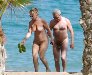 Nudists family bare beach -