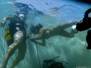 Chinese female dons scuba gear to